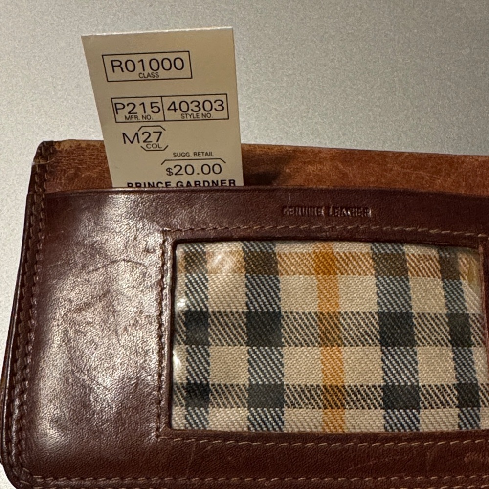 Brown Leather bi fold wallet has room for credit cards, photos and a check book